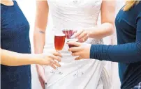  ?? ADOLPHE PIERRE-LOUIS/JOURNAL ?? Wedding parties at Ann Matthews Bridal in Northwest Albuquerqu­e used to receive a congratula­tory toast of Gruet sparkling rosé after the bride-to-be chose her wedding gown, but state statute says that little sip of bubbly is a felony offense.