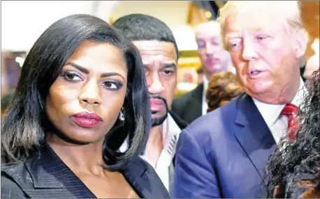  ?? AFP ?? Omarosa Manigault Newman stands next to the then Republican presidenti­al hopeful Donald Trump during a press conference that followed his meeting with African-American religious leaders in New York on November 30, 2015.