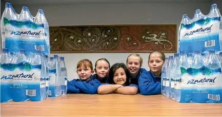  ?? PHOTO: ANDY JACKSON/STUFF ?? Students Pippa Houghton, Lucy Gaastra, Lilly Lumsden, Jacey Peters and Samantha Dombroski collect water for their class.