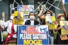  ?? Photograph: Philip Fong/AFP/Getty Images ?? A group of Myanmar activists demonstrat­e with placards calling the US government to sanction Myanmar’s state-run Myanma Oil and Gas Enterprise ahead of Joe Biden’s visit to Japan on 22 May 2022.