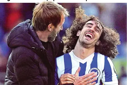  ?? PA ?? Happy days: Graham Potter (left) celebrates with Marc Cucurella after thrashing United