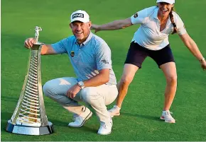  ??  ?? Still got it: Westwood and girlfriend Helen with Race to Dubai trophy