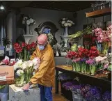  ?? Jon Shapley / Staff photograph­er ?? David Brown arranges the showroom at his flower shop ahead of Valentine’s Day.
