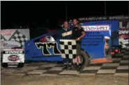  ?? RICH KEPNER - FOR MEDIANEWS GROUP ?? Tom Miller, left, pictured with his son in victory lane, came out of retirement to win his first career Sportsman feature at Grandview Speedway on June 22.