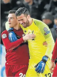  ?? Picture: CARL RECINE/REUTERS ?? TO THE RESCUE: Liverpool’s Alisson celebrates with Andrew Robertson at the end of the match