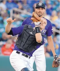  ?? JIM THOMPSON/JOURNAL ?? Isotopes catcher Dustin Garneau, who began the season with the Rockies, entered Saturday hitting .341 with five homers and nine RBIs in 13 games with Albuquerqu­e.