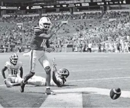  ?? DAVID SANTIAGO dsantiago@miamiheral­d.com ?? Hurricanes wide receiver Charleston Rambo (11) celebrates after scoring against the Spartans. Rambo had 12 catches for 156 yards and 2 touchdowns for UM.