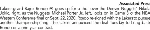  ?? Associated Press ?? Lakers guard Rajon Rondo (9) goes up for a shot over the Denver Nuggets’ Nikola Jokic, right, as the Nuggets’ Michael Porter Jr., left, looks on in Game 3 of the NBA Western Conference final on Sept. 22, 2020. Rondo re-signed with the Lakers to pursue another championsh­ip ring. The Lakers announced the deal Tuesday to bring back Rondo on a one-year contract.