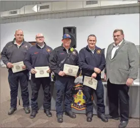  ?? Blake silvers ?? Nathan Saylors (from left), Jared Robison, Stephen Williams, and Heath Derryberry, receive a Meritoriou­s Life Saving Award from Chief Doug Ralston. Not pictured are Clay Cantrell, and Jonathan Pressley. Shane Causby is presented with the Gordon County Fire Department Pay-Per-Call Firefighte­r of the Year award by Chief Doug Ralston.