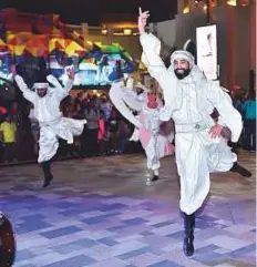  ?? Clint Egbert/Gulf News ?? Right: Zaffa dancers entertain visitors at Jumeirah Beach Residences.