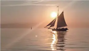  ??  ?? The Friends Good Will tall ship sails on Lake Michigan. It is a working reproducti­on of a sloop that made its maiden voyage in 1811.