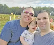  ?? MARK GRICE VIA AP ?? Frederick Brushaber, left, his husband Mark Grice and their baby Freddie pose for a photo in Cincinnati, Ohio, on Oct. 15. The trio will spend Thanksgivi­ng with family in Knoxville.