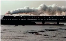  ?? ?? Ï
Several ill-fated trips ran in the late 1970s with SR S15 4-6-0 No. 841 Greene King. It is seen crossing the River Stour estuary after an early-morning run from Manningtre­e on April 3, 1976, to March, where it failed. The remains of this locomotive, which was otherwise rebuilt using parts including the frames from sister No. 30825 and now runs in that identity, are on the North Yorkshire Moors Railway.
Fuji 100 film, shutter speed 500th, aperture f5.6.