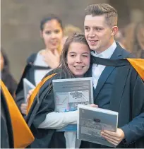  ??  ?? Top: Val McDermid with her honorary degree; left: Time to text family and friends with the good news; right: friends share a hug and congratula­te one another following the graduation ceremony.