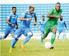  ??  ?? A midfield action during a league match between Enyimba FC and Plateau United