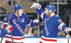  ?? AFP ?? The Rangers’ Ryan Strome, left, and Barclay Goodrow celebrate a goal.