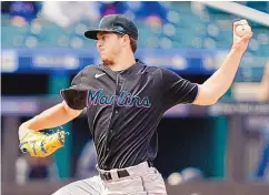  ?? JOHN MINCHILLO/ASSOCIATED PRESS ?? Miami pitcher Trevor Rogers, a native of Carlsbad, pitches during the Marlins’ victory over the host New York Mets and Jacob deGrom on Saturday afternoon. Rogers worked six scoreless innings and struck out 10.