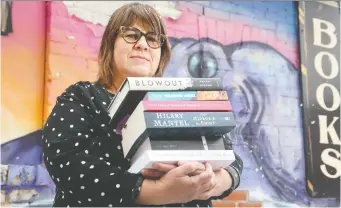  ?? JULIE OLIVER ?? Lisa Greaves, owner of Octopus Books in the Glebe, is appealing to loyal customers to help them through the pandemic. She says the response so far has been overwhelmi­ng.