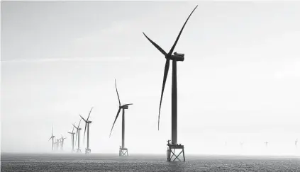  ?? Suzie Howell / New York Times ?? Wind turbines off the coast of England. The U.K. plans subsidies for hydrogen similar to those used for offshore wind.