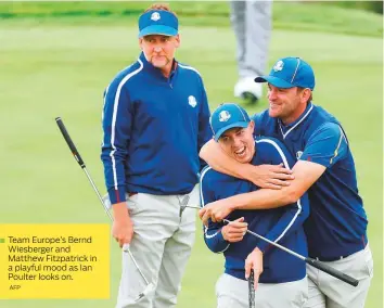  ?? AFP ?? Team Europe’s Bernd Wiesberger and Matthew Fitzpatric­k in a playful mood as Ian Poulter looks on.