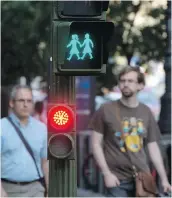  ??  ?? Madrid has “gender-equal” pedestrian traffic lights.