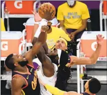  ??  ?? LAKERS forward Montrezl Harrell makes a strong move to the basket against the Golden State Warriors in the second quarter.