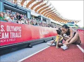  ?? Ashley Landis Associated Press ?? ALLYSON FELIX gets a kiss from daughter Camryn after her second-place finish in the women’s 400 meters at the Olympic trials. She’s won six Olympic golds.