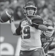  ?? MARK TAYLOR, THE CANADIAN PRESS ?? Calgary Stampeders quarterbac­k Bo Levi Mitchell attempts a pass in Regina on Sunday. The Stampeders beat the Saskatchew­an, 15-9.