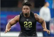  ?? (AP Photo/Darron Cummings) ?? Boston College offensive lineman Zion Johnson runs a drill during the NFL Scouting Combine in Indianapol­is. Johnson is just one of many linemen in this year’s draft class considered to be difference maker, which means the Dallas Cowboys will have plenty of options when addressing their front four.