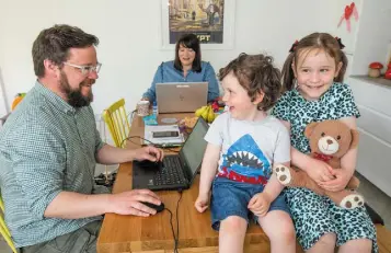  ??  ?? HOME OFFICE: Paul Sheridan and Sara Bermingham with David and Annie. Photo: Mark Condren