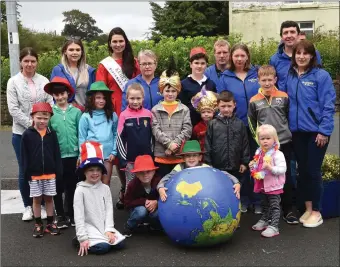  ?? Photo by Michelle Cooper Galvin ?? Pupils and parents from Raheen National School participat­ing in the Gneeveguil­la GAA Carnival Fancy Dress Parade in Gneeveguil­la on Sunday.