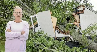  ?? KELLY HODEL/STUFF ?? Orini Combined School teacher Brenna O’Hearn is devastated by the destructio­n of her classroom.