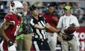  ?? ROSS D. FRANKLIN — THE ASSOCIATED PRESS FILE ?? In this file photo, NFL official Sarah Thomas tosses the ball back to the line of scrimmage as Arizona Cardinals’ Brittan Golden (10) heads into the game during the first half of an NFL preseason football game against the Kansas City Chiefs in...