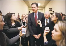  ?? Chip Somodevill­a / Getty Images ?? Former FBI Director James Comey is surrounded by reporters after testifying to the House Judiciary and Oversight and Government Reform committees at the Rayburn House Office Building on Capitol Hill on Friday in Washington.