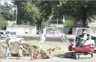  ?? Brodie Johnson • Times-Herald ?? Pipeline work continues throughout the city, with work being done today along Garland Street in front of the Forrest City Fire Department. Employees with H.I.S. Pipeline of Ball, La., dig to a pipeline located along Garland.