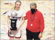  ?? David Butler II / USA TODAY / Pool / Contribute­d Photo ?? UConn Huskies guard Paige Bueckers (5) is awarded most outstandin­g player as she poses for a picture with head coach Geno Auriemma after defeating the Marquette Golden Eagles in the Big East Championsh­ip game at Mohegan Sun.
