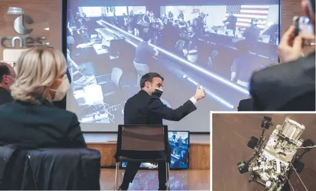  ?? Pictures: CHRISTOPHE PETIT TESSON/ POOL /AFP AND NASA/JPL-CALTECH ?? French President Emmanuel Macron gives the thumb-up as he sits in front of a screen broadcasti­ng the landing of NASA’s Perseveran­ce Mars rover on the planet Mars, and the rover Perseveran­ce, inset, just before landing on Mars.