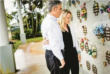 ?? NYT PHOTOS ?? Tom and Gena Hoyer visit the gravesite of their son at a cemetery in Pompano Beach in May. Over four years later, as the perpetrato­r’s trial for sentencing continues, the couple has come to think of justice more broadly — not just as the punishment of an individual, but as their own power to try to make schools safer, and to rebuild their family.
