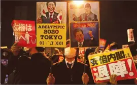  ??  ?? Protesters at a rally denouncing Japanese Prime Minister Shinzo Abe and Finance Minister Taro Aso in front of the PM’s official residence in Tokyo