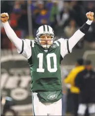  ?? Bill Kostroun / Associated Press ?? Jets quarterbac­k Chad Pennington celebrates a second-quarter touchdown against the Colts during an AFC wild card game at Giants Stadium on Jan. 4, 2003, in East Rutherford, N.J.