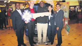  ??  ?? NEW WHEELS. The winner of the Nissan NP200 is Steven Sefofa, seen here receiving his prize.