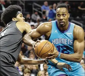  ?? CHUCK BURTON / AP ?? Hornets center Dwight Howard, who went from high school to the NBA, is on his fifth team since being selected first overall by the Magic in 2004.