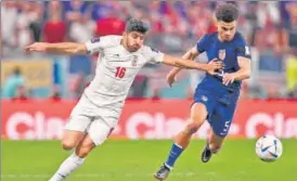  ?? AFP ?? The United States stormed into the World Cup last 16 on Tuesday by beating Iran 1-0 at a cacophonou­s Al Thumama Stadium in a showdown shrouded by decades of enmity between the two nations.