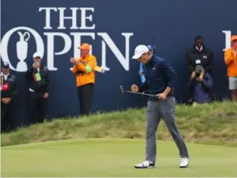  ??  ?? Jordan Spieth celebrates after sinking the winning putt (Getty)