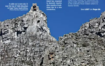  ?? Photo/Nardus Engelbrech­t ?? A cable car is seen July 31 near the top of Table Mountain in Cape Town, South Africa.