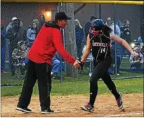  ?? BILL RUDICK — FOR DIGITAL FIRST MEDIA ?? Daily Local News Softball Player of the Year Ashley Mendenhall high-fives her father, Bill Mendenhall, after a home run.