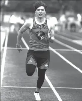  ?? Allie Borders ?? Jorge Flores of Broken Bow runs down the straight away during the 100 meter dash at the Marsh Beck Invitation­al. He finished 12th in the 100 and ninth in the 400 meter dash.