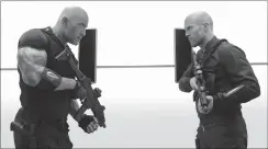  ?? Daniel Smith / Universal Pictures via AP ?? Hobbs & Shaw: This image released by Universal Pictures shows Dwayne Johnson, left, and Jason Statham in a scene from "Fast & Furious Presents: Hobbs & Shaw."