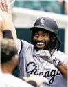  ?? CARLOS OSORIO/AP ?? White Sox center fielder Brian Goodwin is greeted after his three-run home run during the second.