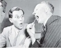  ?? PHOTO: ALEXANDER TURNBULL LIBRARY ?? ‘‘Use your teeth and your tongue.” NZBS head of drama Bernard Beeby puts a young radio announcer through the mill in 1951.